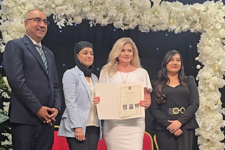 Members receiving recognition on stage